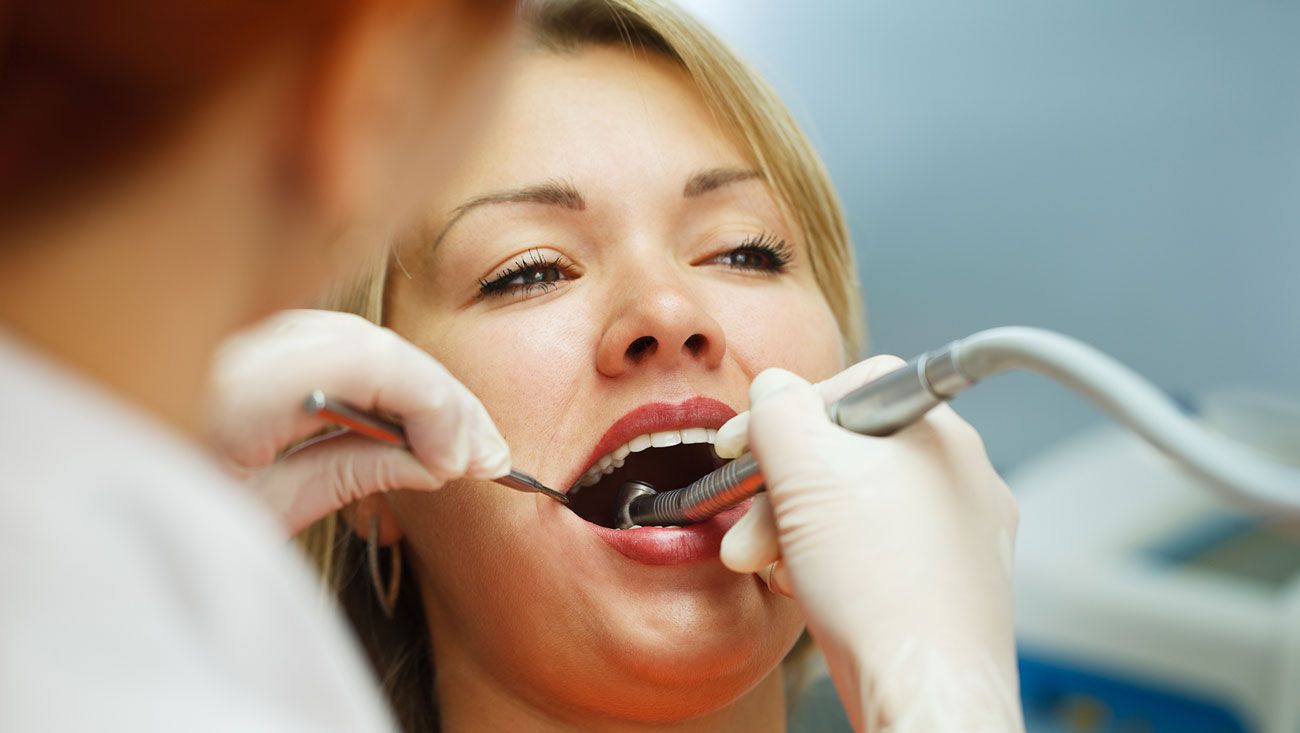 One of our expert dentists giving emergency treatment to a patient.